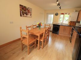 A kitchen with a dining table and chairs at 4 Mellbecks Mews Kirkby Stephen