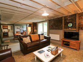 A living room with a sofa and coffee table at Childwall Cottage in TULLOGHER