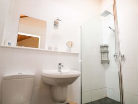 A bathroom with a sink and shower at The Lodge at Lamburn