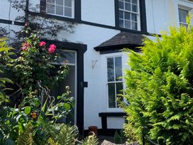 An outdoor view of a house with plants and flowers at 3 Newboro Terrace in Conwy