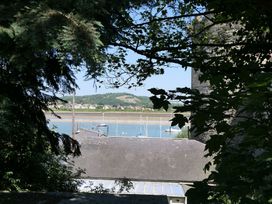 A view of boats on water and a roof from 3 Newboro Terrace in Conwy