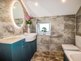 A bathroom with a sink and toilet at Meadow Retreat in Bodmin