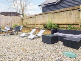 A garden area with seating and loungers at Meadow Retreat in Wadebridge