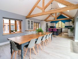 A kitchen with a dining table and chairs at Hazeldene near Harvington