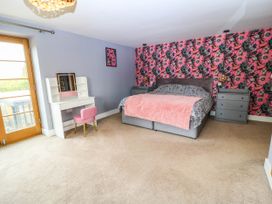 A bedroom with a bed and vanity at Hazeldene near Harvington