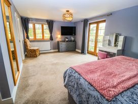 A bedroom with a bed and a dresser at Hazeldene near Harvington
