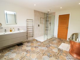 A bathroom with a shower and a sink at Hazeldene near Harvington