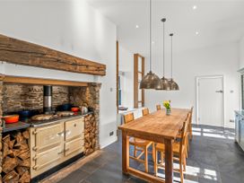 A kitchen with a dining table and chairs at Chantry Studio in Kingsbridge