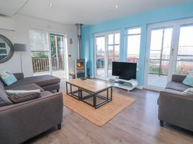 A living room with a coffee table and TV at Warleggan Redruth