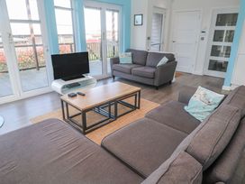 A living room with a sofa and television at Warleggan in Redruth