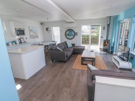 A living room with a sofa and fireplace at Warleggan in Redruth