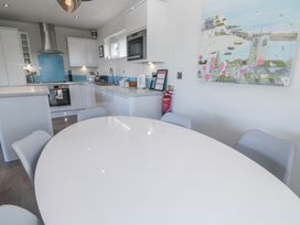 A kitchen with a table and chairs at Warleggan in Redruth