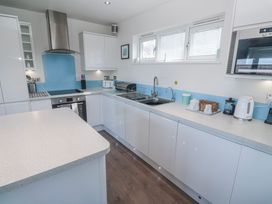 A kitchen with cabinets and appliances at Warleggan in Redruth