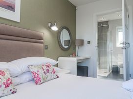 A bedroom with a bed and an ensuite bathroom at Warleggan in Redruth