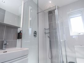 A bathroom with a shower and sink at Warleggan in Redruth