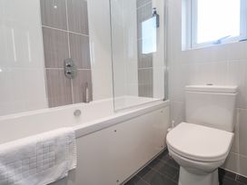 A bathroom with a bathtub and shower at Warleggan Redruth
