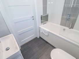 A bathroom with a sink bathtub and toilet at Warleggan Redruth