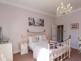 A bedroom with a bed and lamp at Annie's Place in Sleights