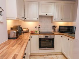 A kitchen with appliances and a countertop at Annie's Place in Sleights