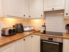 A kitchen with appliances and food items at Annie's Place in Sleights