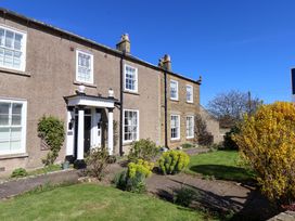 A building with a garden and pathway at Annie's Place in Sleights