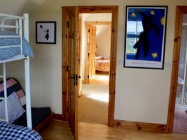A bedroom with a bunk bed and artwork at Welcome to the wild Atlantic way, Mulroy Bay
