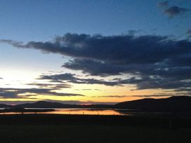 A scenic view of the sunset over water at Welcome to the wild Atlantic way Mulroy Bay