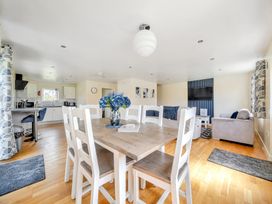 A living room with a dining area and kitchen at Lodge 4 near Brigg