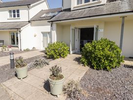 An outdoor view of a house entrance with planters at The Bolthole in Newport