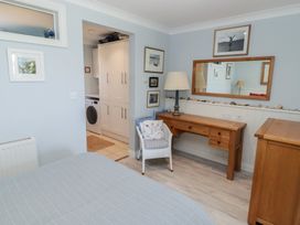 A bedroom with a bed and a desk at The Bolthole in Newport