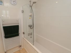 A bathroom with a bathtub and shower at The Bolthole in Newport