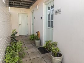An outdoor entryway with doors and planters at The Bolthole in Newport