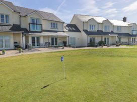 An outdoor area with houses and a golf flag at The Bolthole in Newport