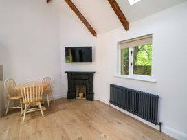 A dining room with a table and chairs at The Mews @ Derrybawn, Laragh, County Wicklow