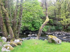 A outdoor scene with trees and a river at The Mews @ Derrybawn, Laragh, County Wicklow