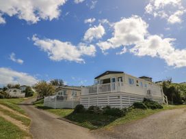 Mobile homes on a hillside with a pathway at Swanny View in Swanage
