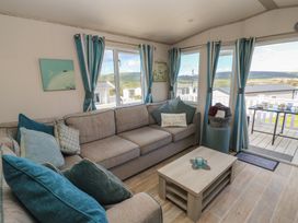 A living room with a sofa and coffee table at Swanny View in Swanage