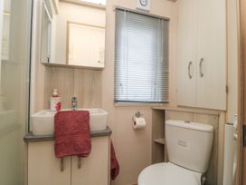 A bathroom with a sink and toilet at Swanny View in Swanage