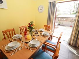 A dining room with a table set for a meal at Willow cottage Seahouses