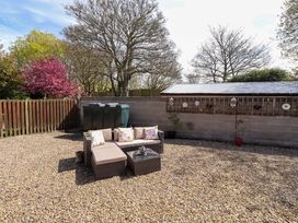 A garden with seating and a table at Willow cottage in Seahouses