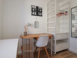 An office space with a desk and lamp at Cwtch Treth in Newquay