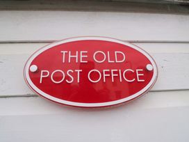 A sign that reads The Old Post Office