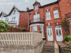 A house with a fence and balcony at 30 Prospect Hill Whitby