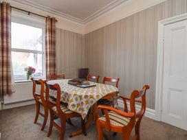 A dining room with a table and chairs at 30 Prospect Hill, Whitby