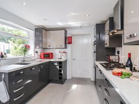 A kitchen with countertop, microwave, and sink at 30 Prospect Hill, Whitby