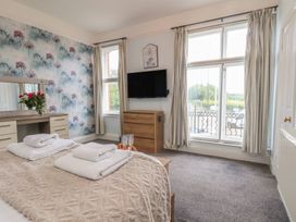 A bedroom with a bed and television at 30 Prospect Hill in Whitby
