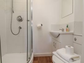 A bathroom with a shower and sink at 30 Prospect Hill, Whitby