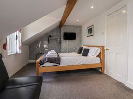 A bedroom with a bed and television at 30 Prospect Hill in Whitby