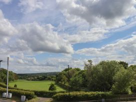 An open field with trees and clouds at 30 Prospect Hill in Whitby