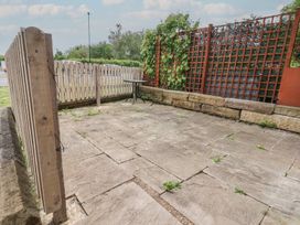 A garden area with paving stones and a trellis at 30 Prospect Hill in Whitby